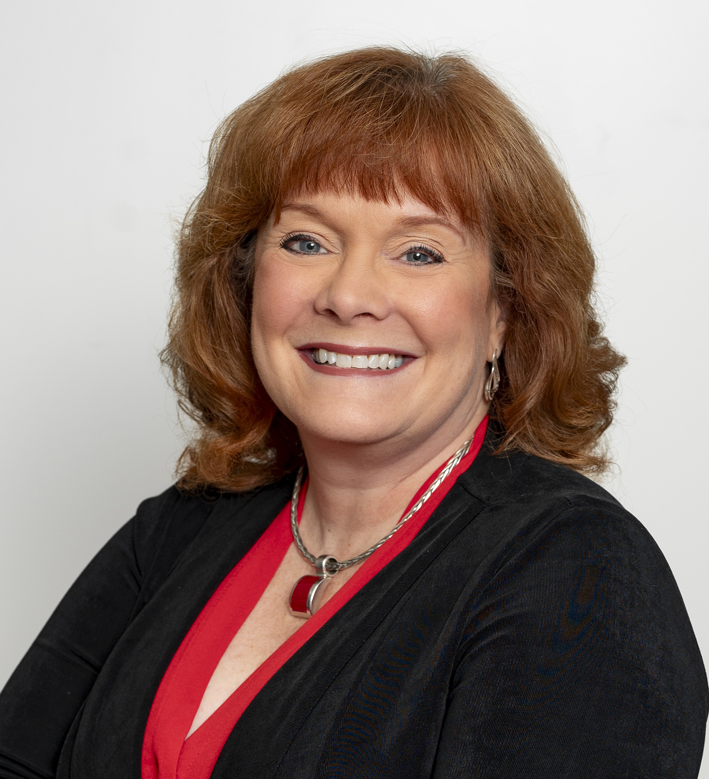 Headshot of Diane Goffinet in black jacket against white background