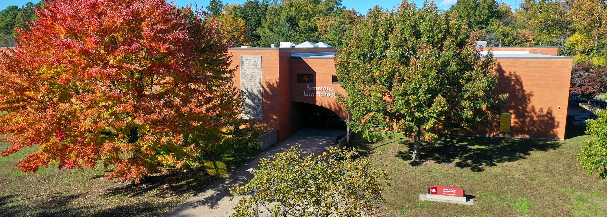 view of fall leaves and campus lake